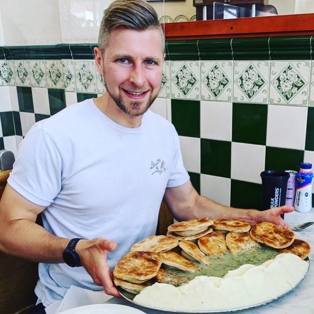 Max with his platter of pie and mash